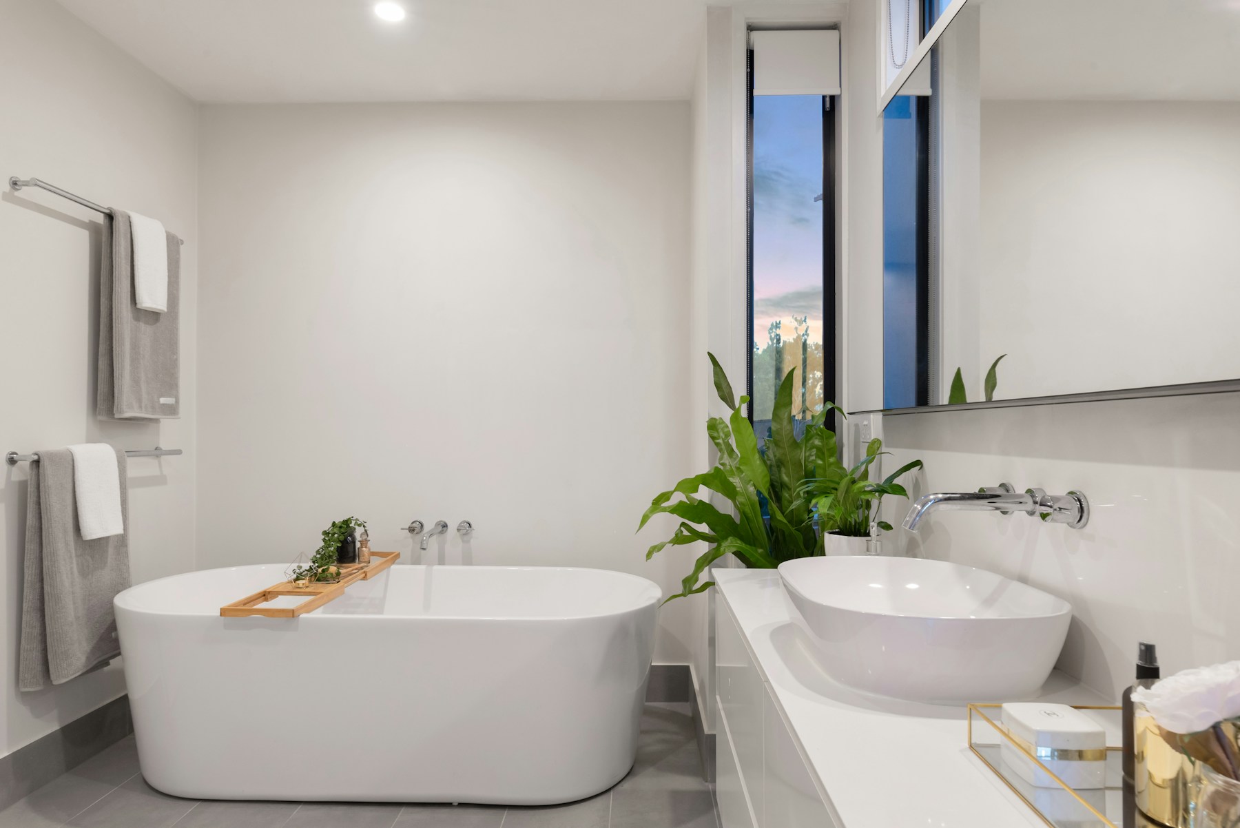 Freestanding white bathtub in a contemporary bathroom